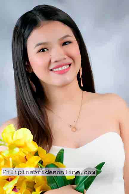Featured Filipino woman holding yellow flowers, representing the beautiful singles available on the dating site.
