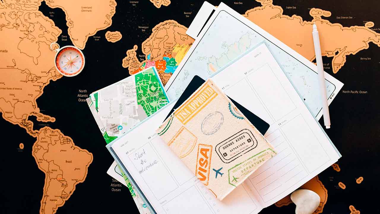 A Philippine visa stamp in a passport with an airline ticket, symbolizing international travel.
