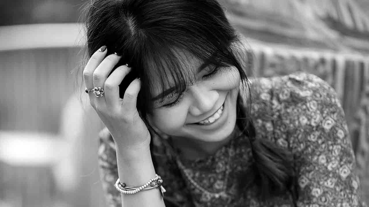 Asian girl from different cultural backgrounds sitting closely and gagel.